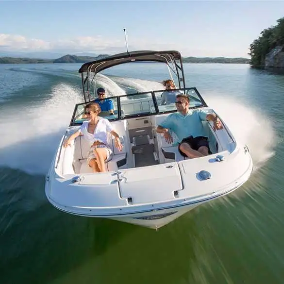Group of friends going for boat ride in a used Stingray motorboat running in open water